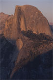 A tall granite face in warm light