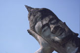 A sculpted reclining head seen from below